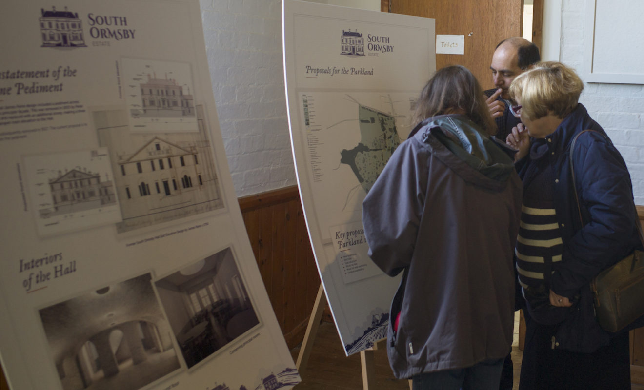 People Looking At Information About The Estate
