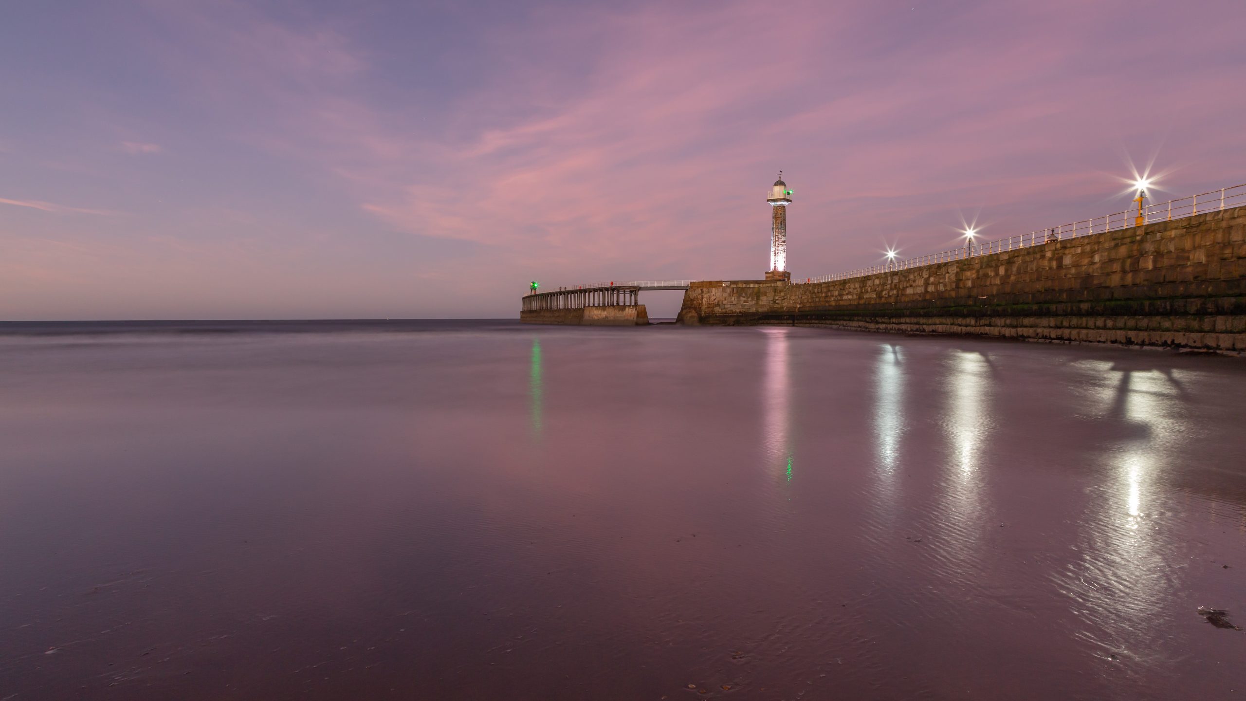 The beach and the pier when the sun is setting