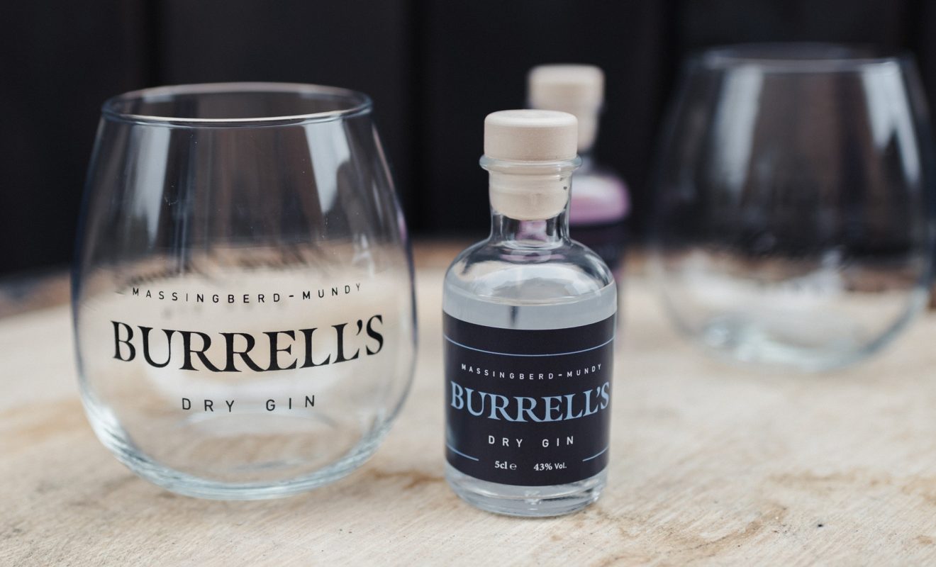 Burrell's London Dry Gin alongside a stemless balloon glass