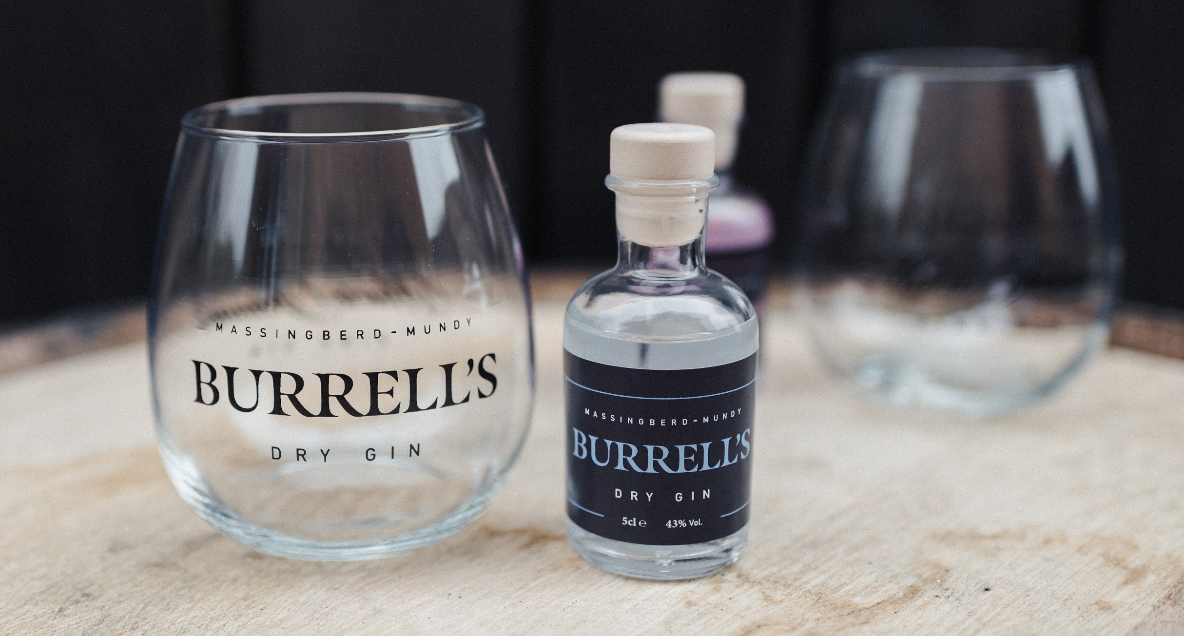 Burrell's London Dry Gin alongside a stemless balloon glass