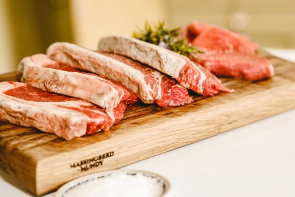 Lincoln Red Beef Steaks on Wooden Chopping Board