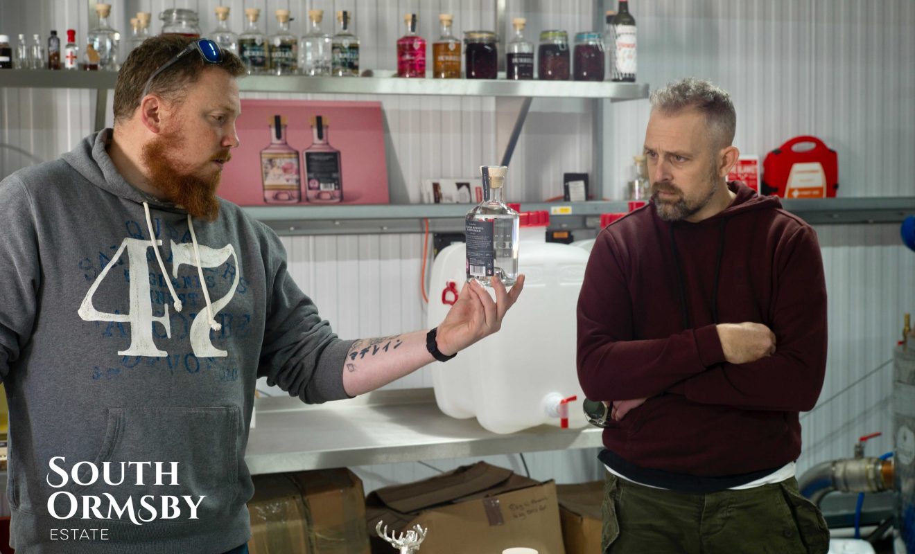 Tristan discussing Distillery Gin with the Bluebell Inn owner