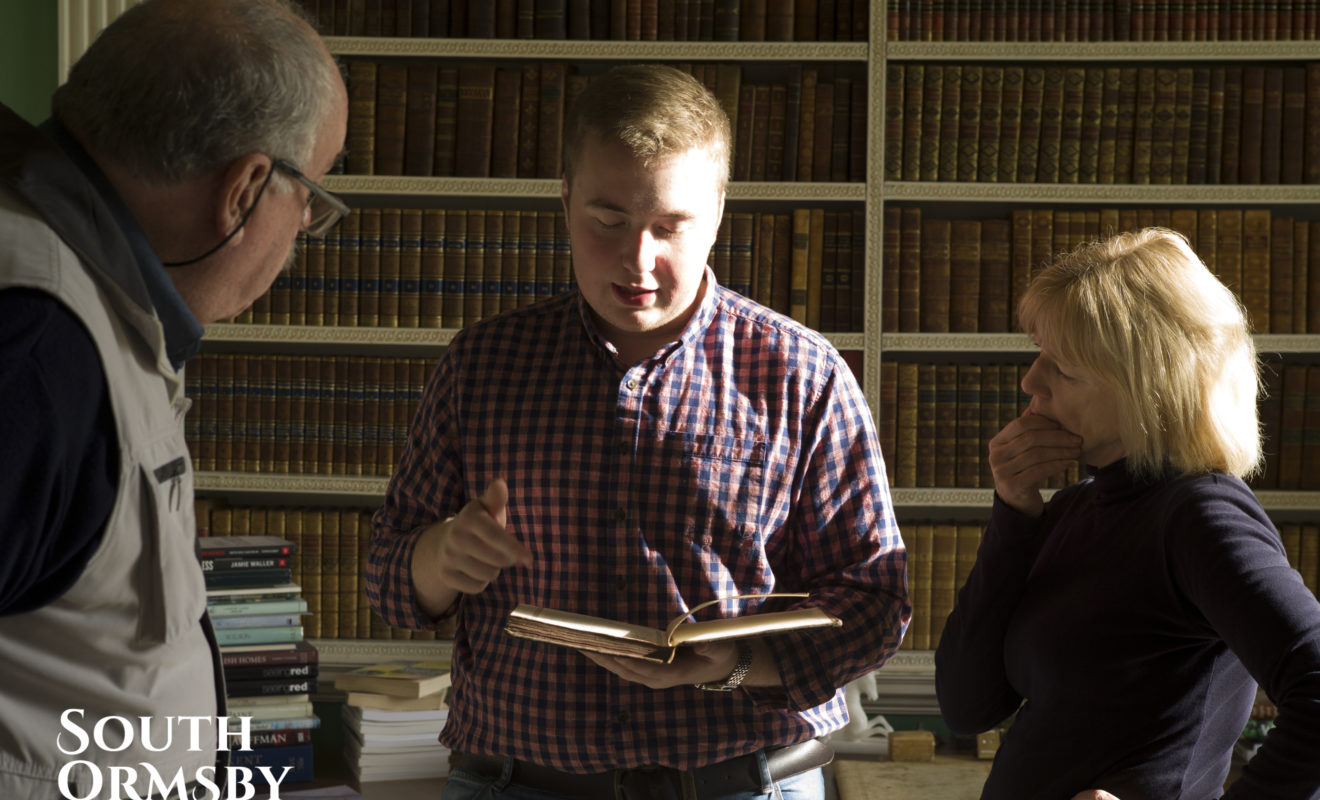 Man Reading Out Book