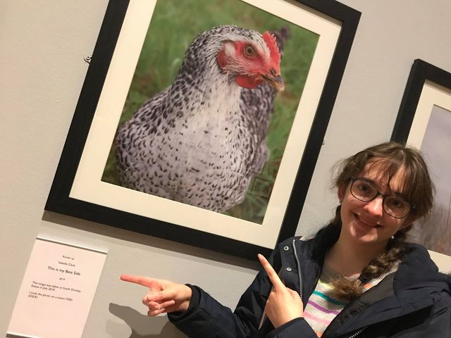 Woman Pointing At Photo