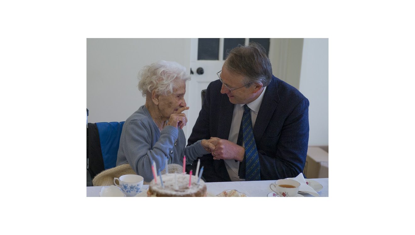 Comforting image of a elderly lady and man