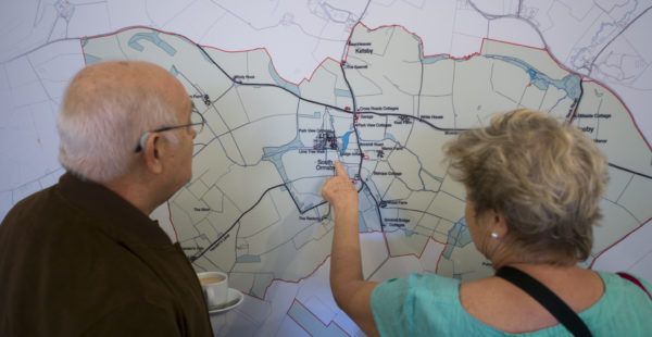 A couple looking at a map of South Ormsby