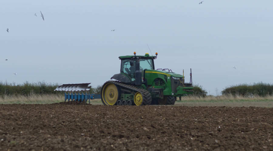 Tractor making its way through a Lincolnshire Field